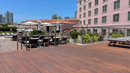 Well-maintained bamboo decking finished with exterior oil on a commercial poolside terrace.