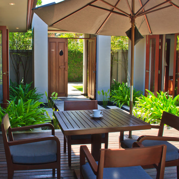 Photo of outdoor deck and patio set with teak wood.